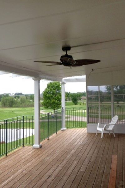 Website covered porch overlooking golf course