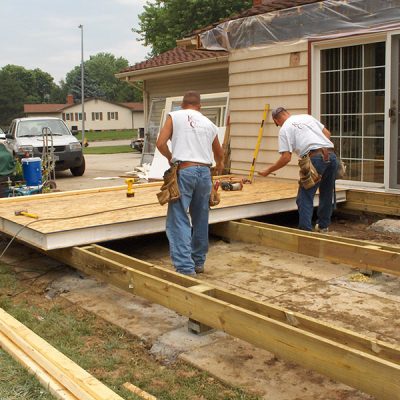 men installing wood deck kenosha wi